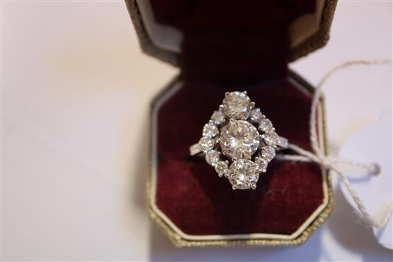 An attractive 18ct white gold and diamond cluster elliptical shaped ring, size M/N.